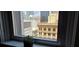 Charming city view from the window overlooking historic buildings, with plant decor at 20 Marietta Nw St # 16A, Atlanta, GA 30303