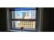 Skyline view from the window, with decorative flowers on the window sill at 20 Marietta Nw St # 16A, Atlanta, GA 30303