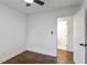 Comfortable bedroom featuring hardwood floors, a ceiling fan and convenient access to an adjacent bathroom at 3215 Pennignton Cir, Atlanta, GA 30354