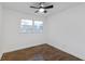 Cozy bedroom featuring hardwood floors and a window offering plenty of natural light at 3215 Pennignton Cir, Atlanta, GA 30354