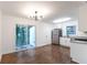 Modern kitchen featuring stainless steel appliances, granite countertops, and a sliding door to the yard at 3215 Pennignton Cir, Atlanta, GA 30354