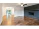 Inviting living room features hardwood floors, a brick fireplace, and ample space for relaxation at 3215 Pennignton Cir, Atlanta, GA 30354