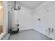 Utility room with water heater, wire shelving, and gray painted floor at 3215 Pennignton Cir, Atlanta, GA 30354