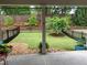 Well-manicured backyard featuring a charming black metal fence and lush landscaping at 423 Hunt Ne St, Marietta, GA 30060
