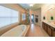 Ensuite bathroom with double sink vanity and separate soaking tub and shower at 423 Hunt Ne St, Marietta, GA 30060
