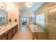 Bright bathroom featuring a soaking tub and separate glass shower at 423 Hunt Ne St, Marietta, GA 30060