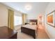 Comfortable bedroom featuring a dark wood bed frame and ensuite bathroom at 423 Hunt Ne St, Marietta, GA 30060