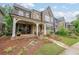Charming home with a rocking chair front porch and manicured lawn at 423 Hunt Ne St, Marietta, GA 30060