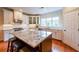 Modern kitchen featuring white cabinets, granite island, and hardwood floors at 423 Hunt Ne St, Marietta, GA 30060
