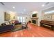 Comfortable living room with hardwood floors, stone fireplace, and a cozy seating area at 423 Hunt Ne St, Marietta, GA 30060
