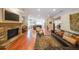 Open floor plan connects the living room with a stone fireplace to the kitchen and dining area at 423 Hunt Ne St, Marietta, GA 30060