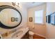 Chic powder room with granite countertops, stylish mirror, and modern fixtures at 423 Hunt Ne St, Marietta, GA 30060