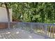 Back deck featuring wood flooring and railing overlooking the backyard at 509 Roy Sw St, Atlanta, GA 30310