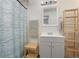 Bathroom showing a sink, cabinets, shelving and stylish shower curtain at 509 Roy Sw St, Atlanta, GA 30310