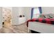 Bedroom features a bathroom view, ample natural light, and modern flooring at 509 Roy Sw St, Atlanta, GA 30310