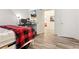 Bedroom with desk, tv and doorway to living area. Modern flooring adds style at 509 Roy Sw St, Atlanta, GA 30310