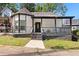 Charming renovated home with covered porch, black and white trim and unique turret style architecture at 509 Roy Sw St, Atlanta, GA 30310