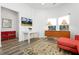 Well-lit living room with wood floors, accent furniture and bright windows at 509 Roy Sw St, Atlanta, GA 30310