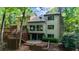 Multi-tiered deck area offers stunning views of the lush backyard at 1665 Chevron Way, Sandy Springs, GA 30350