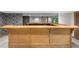 View of a wooden bar in a finished basement with stylish design at 1665 Chevron Way, Sandy Springs, GA 30350