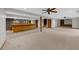 Spacious basement featuring carpet, bar area, and staircase at 1665 Chevron Way, Sandy Springs, GA 30350