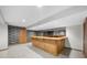 Basement wet bar area with tile floor and wall mirror at 1665 Chevron Way, Sandy Springs, GA 30350
