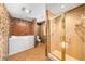 Bathroom with a walk-in tub, separate shower, and decorative walls at 1665 Chevron Way, Sandy Springs, GA 30350