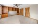 Bedroom with built-in bookshelves and closet with bi-fold doors at 1665 Chevron Way, Sandy Springs, GA 30350