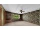 Spacious bedroom featuring built-in bookshelves and a view of lush greenery at 1665 Chevron Way, Sandy Springs, GA 30350