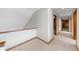 Bright hallway with carpeted floors leading to bedrooms and walk-in closet at 1665 Chevron Way, Sandy Springs, GA 30350