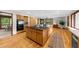 Spacious kitchen with wooden floors, center island, stainless steel appliances, and ample cabinet space at 1665 Chevron Way, Sandy Springs, GA 30350
