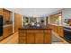 Bright and airy kitchen with wooden cabinets, granite countertops, modern appliances, and plenty of storage at 1665 Chevron Way, Sandy Springs, GA 30350