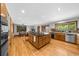 Gourmet kitchen featuring a large island with granite countertops and stainless steel appliances at 1665 Chevron Way, Sandy Springs, GA 30350