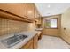 Spacious laundry room with ample storage and a convenient sink at 1665 Chevron Way, Sandy Springs, GA 30350