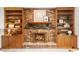 Cozy brick fireplace with built-in shelving and wooden cabinets at 1665 Chevron Way, Sandy Springs, GA 30350