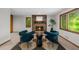 Living room featuring chairs, fireplace, and natural light at 1665 Chevron Way, Sandy Springs, GA 30350