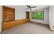 The open living room features built-in shelves and storage with a large window at 1665 Chevron Way, Sandy Springs, GA 30350