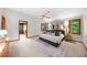 Spacious main bedroom featuring a ceiling fan, neutral walls, and light-colored carpet at 1665 Chevron Way, Sandy Springs, GA 30350