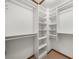 A well-organized walk-in closet with built-in shelving at 1665 Chevron Way, Sandy Springs, GA 30350
