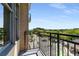 Enjoy city views from this condo balcony with black metal railing, tan stucco, and large window at 201 W Ponce De Leon Ave # 515, Decatur, GA 30030