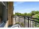 Balcony with a neighborhood street view and black metal guardrails at 201 W Ponce De Leon Ave # 515, Decatur, GA 30030