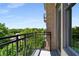 This condo balcony offers a great view of surrounding greenery through black metal railings and large windows at 201 W Ponce De Leon Ave # 515, Decatur, GA 30030