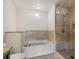 Bathroom featuring tiled shower, soaking tub, granite countertop and neutral finishes at 201 W Ponce De Leon Ave # 515, Decatur, GA 30030