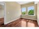 Bedroom with hardwood floors featuring bright, natural light and tree-lined views at 201 W Ponce De Leon Ave # 515, Decatur, GA 30030