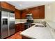 This kitchen boasts stainless appliances, dark cabinetry, and white countertops at 201 W Ponce De Leon Ave # 515, Decatur, GA 30030