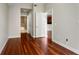 Open-concept living room showcasing gleaming hardwood floors and neutral wall paint at 201 W Ponce De Leon Ave # 515, Decatur, GA 30030