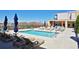 Inviting outdoor pool and sundeck with comfortable lounge chairs and beautiful landscaping at 201 W Ponce De Leon Ave # 515, Decatur, GA 30030
