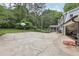 Spacious backyard with a basketball hoop, a screened-in porch and garage at 3501 Emperor Way, Tucker, GA 30084