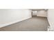 An open basement area with carpeting, painted walls, and base molding at 3501 Emperor Way, Tucker, GA 30084