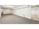 View of the carpeted basement featuring painted walls and an access door at 3501 Emperor Way, Tucker, GA 30084